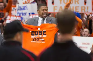 Rose displays a Syracuse-themed shirt while announcing his pick for the game. 