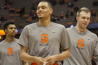 Tyler Ennis, fresh off arguably  the best shot of the college basketball season, smiles during warm-ups. 
