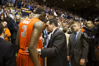 Mike Krzyzewski embraces Jerami Grant and Tyler Ennis following Duke's 66-60 victory over Syracuse 