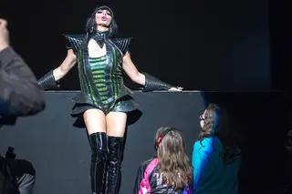 On her way back from strutting down the aisle of the audience, Alyssa Edwards stops in front of two young girls to finish up her song. 