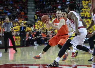 Trevor Cooney tries to split two Maryland defenders while carrying the ball in transition. 
