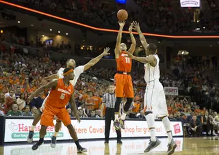 Tyler Ennis fires a 3-point field goal from the right wing. The Syracuse point guard finished with 13 points. 