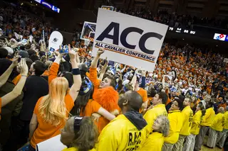 A Cavaliers fan holds up a sign that signifies Virginia's ACC dominance this season. 