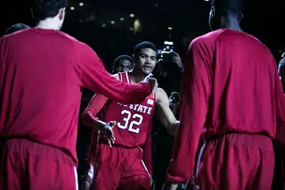 N.C. State forward Kyle Washington interacts with his teammates as his name is announced. 