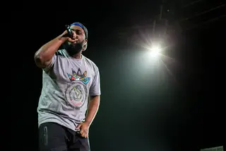 Bas, off of J.Cole's Dreamville label, raps during the opening act in the Carrier Dome on March 21, 2014.