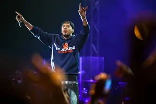 J.Cole, in Syracuse apparel, thanks the crowd as he performs his last song of the night,  
