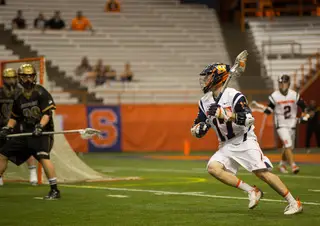 Dylan Donahue works the left side of Bryant's defense Sunday night. The Syracuse attack scored one goal from five shots and have one assist in the game.