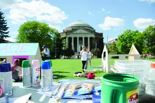 Habitat for Humanity provides spray paint, paintbrushes, and other supplies for Shack-A-Thon participants to use for decoration on the quad. 