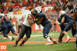Rob Trudo protects SU quarterback Terrel Hunt as a Maryland defensive lineman tries to come around the edge. 