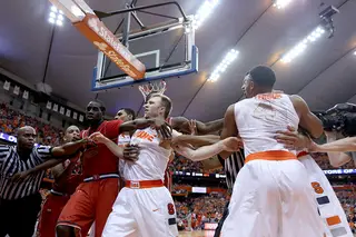 Syracuse and St. John's get into a scrum under the basket after a hard foul on Chris McCullough by Rysheed Jordan. 