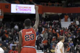Jordan points to the ceiling after the Red Storm's win in the Carrier Dome.