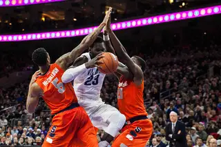 Ochefu attempts to split McCullough and Roberson. Villanova was held to only 31 points in the first half.