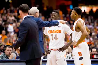 Boeheim gives instruction to Joseph and Patterson during a stoppage of play.