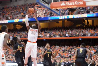 Forward Rakeem Christmas goes up for a layup with two defenders watching. The senior had 11 points on 4-of-6 shooting in the first half.