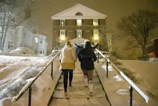 New members run up the front steps of Kappa Kappa Gamma on Comstock Ave.