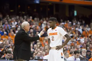 Jim Boeheim points a finger while instructing sophomore B.J. Johnson. The forward had only two points in seven minutes of action. 