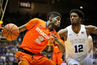 Johnson works his way around Duke's Winslow in the paint.