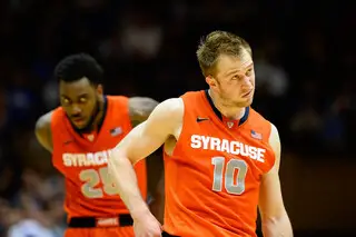 Cooney, left, and Christmas look on during a Syracuse free-throw.