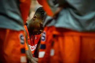 Roberson listens in during a time-out in the second half.