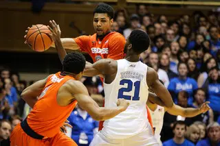 Gbinije looks for an opening past Duke's Amile Jefferson, but is blocked.