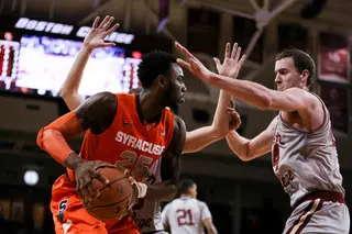 SU forward Rakeem Christmas faces a double team from a pair of Boston College defenders, including center Dennis Clifford.