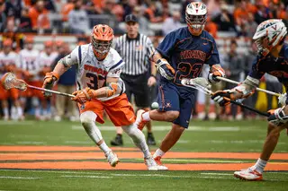 Ben Williams runs after grabbing a faceoff. Syracuse won 20-of-27 on the day. 
