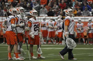 Wardwell and Syracuse defenders look up at the video replay on the scoreboard after being scored on.