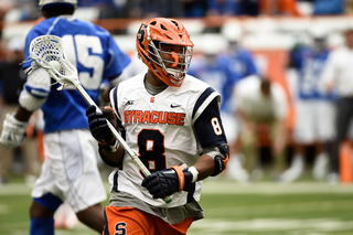 Hakeem Lecky cradles the ball in the first half. The senior scored one of SU's 19 goals on the afternoon.