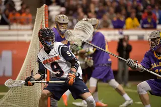 Syracuse's Barber faces away from the crease as he looks for an offensive opportunity.