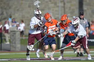 A scrum of players go for a ground ball. The Orange had 29 ground balls while CU had 20. 