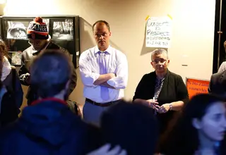Gabe Nugent, associate general counsel for SU, and Bea Gonzalez, University College dean, talk with protesters on Nov. 7, 2014.