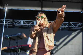Tove Lo directs the crowd with her hand motions during her set. 