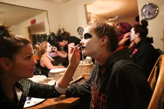 The Dombroski family uses a kitchen table as a face paint and makeup salon.
