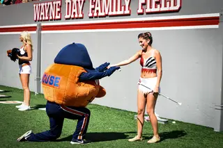 Otto the Orange got down on one knee for a baton thrower. No word on what she said.