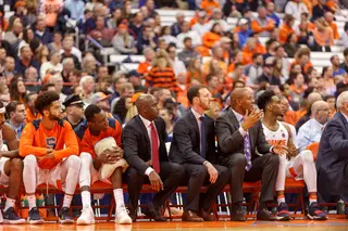 Syracuse's bench looks at the game action.