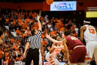 Syracuse and Boston College battle for the jump ball.