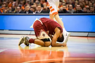 A Boston College player loses his footing running across the court.