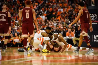 Syracuse and Boston College players scramble for a loose ball.