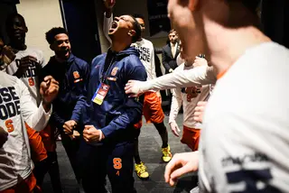 Elijah Hughes pumps up the team before the 10 p.m. tip, Syracuse's latest start time this season. 