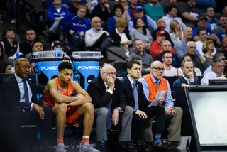 The Syracuse bench looks onto the action.
