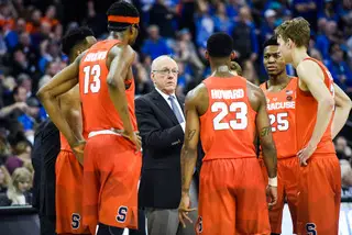 Syracuse huddles during a timeout. Boeheim said last week that he offers fewer pointers during stoppages and lets his players rest.