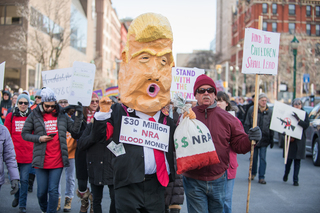 A protester dressed up as President Donald Trump during the march.