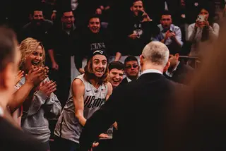 Hurley walks off the court through a sea of UConn fans there to celebrate the big win over a ranked opponent. 