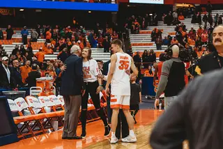 Juli and Jamie Boeheim walked onto the court after the game to congratulate the boys. 
