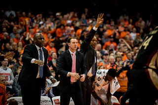 The Syracuse coaching staff reacts to a call Tuesday night at the Carrier Dome, where the Orange hadn't played in nearly two weeks. 