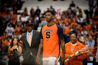 Syracuse honored its seniors on Monday night in the Carrier Dome, with nearly 30,000 fans in attendance. Senior point guard Frank Howard walked to midcourt with his mom and dad. 