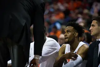 Brissett listens to Jim Boeheim after being pulled from the game. He was subbed back in after Chukwu fouled out of the game with less than two minutes left. 