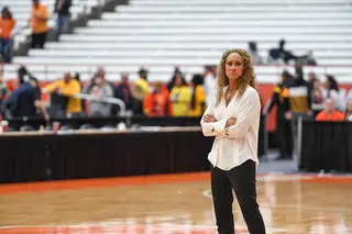 Tammi Reiss stands on the sideline. She's in her third year as a Syracuse assistant.