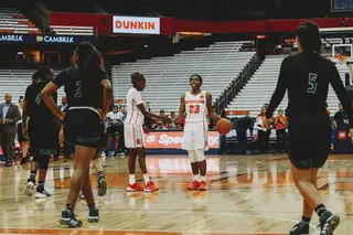 Lewis and Cooper high-five after Syracuse's win, the two combining for 26 of the Orange's 66 points.
