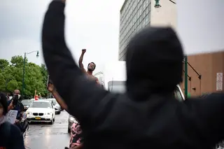 A protester leaned out of his car window to show support for the movement and join the protest.